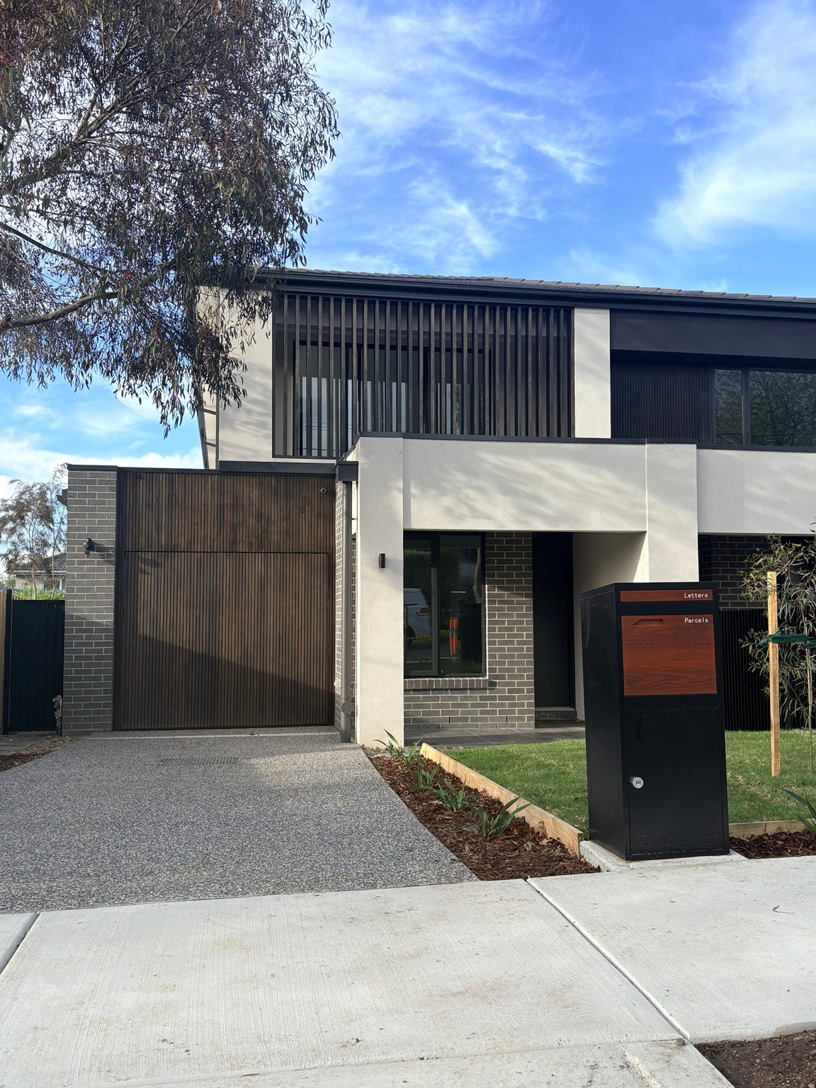 Fence mounted parcel letterbox installation on Australian front fence