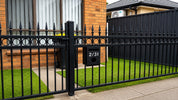 Modern home front garden parcel letterbox installation with timber grain finish